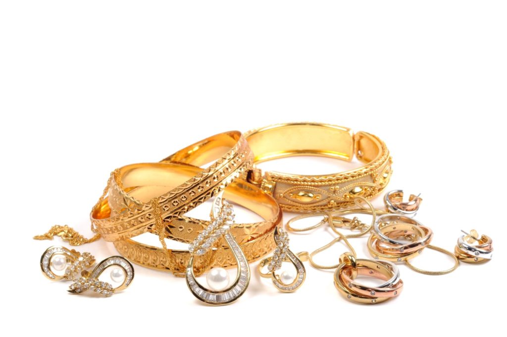 gold jewelry laying in a small pile