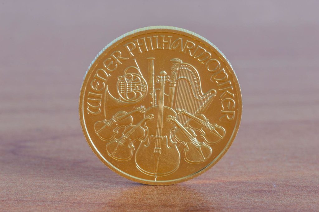 Vienna Philharmoniker gold coin on wooden table