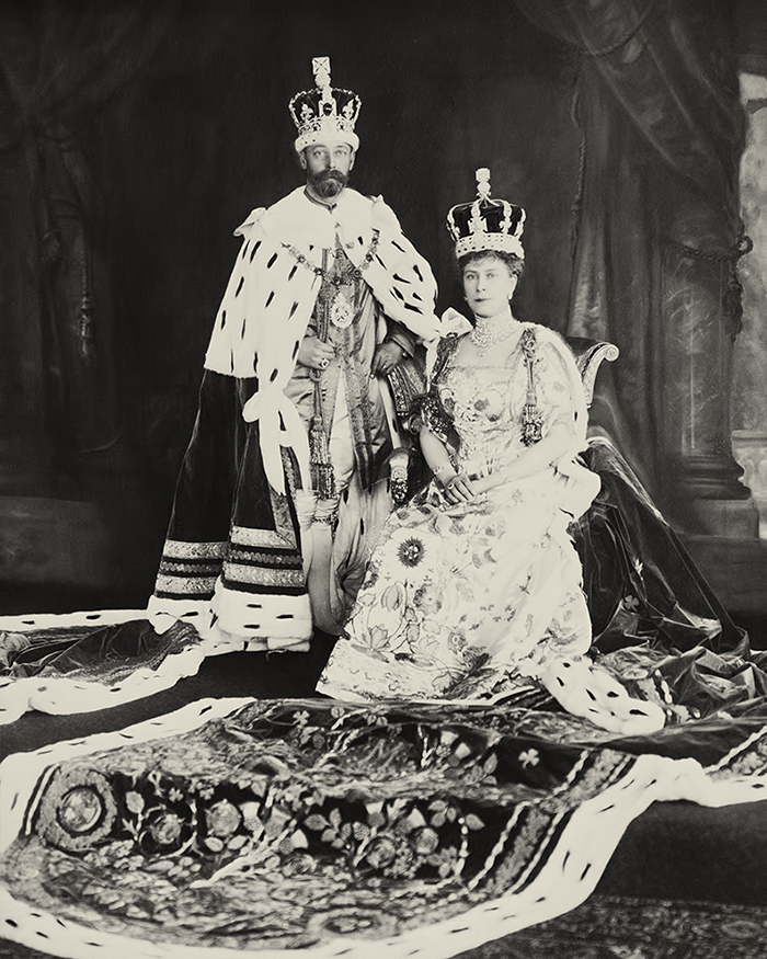 King George V and Queen Mary in their crowns and coronation robes.