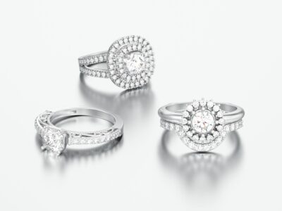 Three different white gold or silver decorative diamond rings