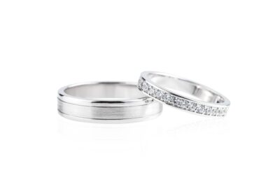Two wedding rings isolated on white background.