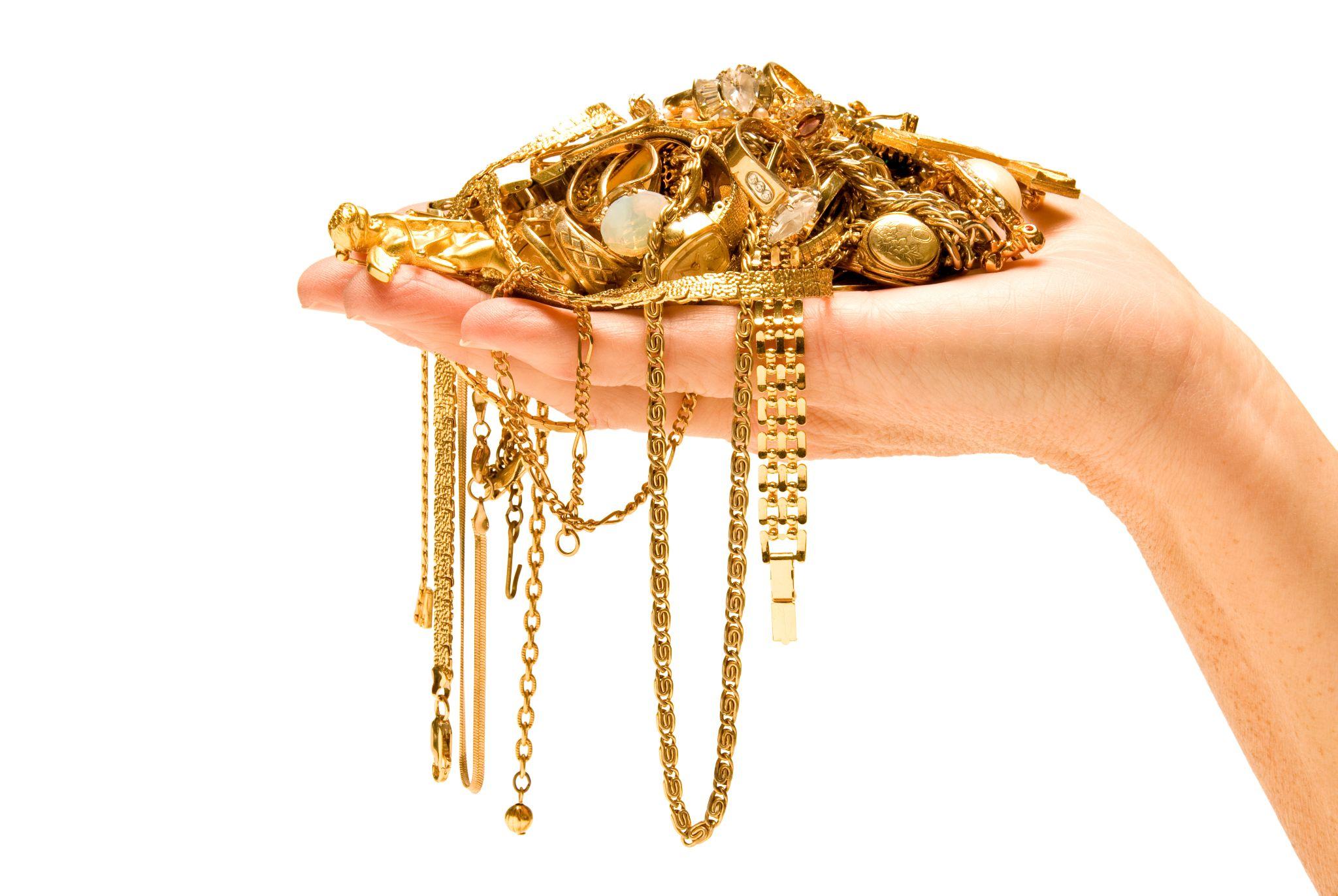 Hand holding beautiful gold ready to sell.